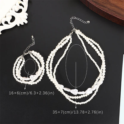 Layered Pearl Necklace & Bracelet Set: Elegant Heart Accents for Women